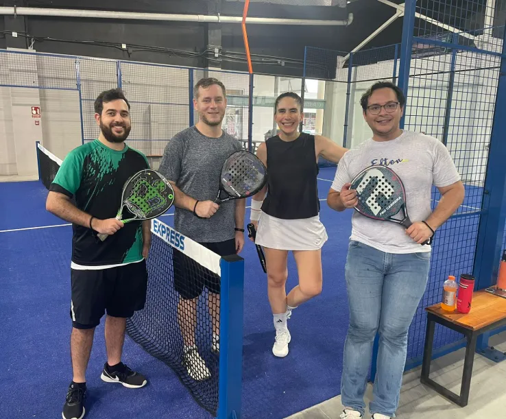women and man playing padel